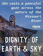 During the day, the South Dakota wind brushes the diamonds in her star quilt, causing blue shades to twinkle in the sunlight. At night, she stands illuminated and strong. She is Dignity.